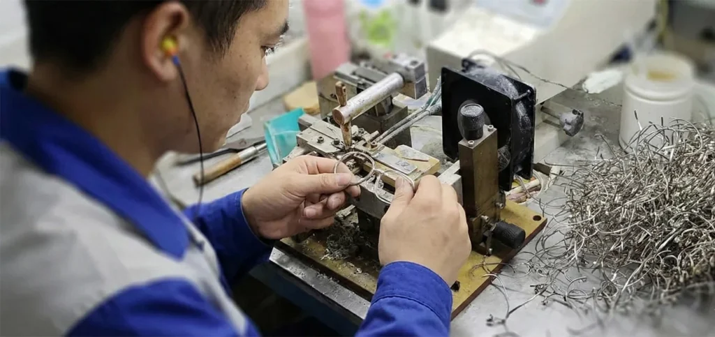 Inside a sunglasses manufacturing workshop Sunglasses frames being produced on the factory floor during manufacturing